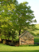 springhouse in spring - side of page